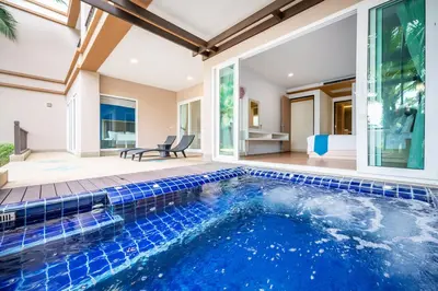 an indoor pool in a house with a swimming pool at Hotel COCO Phuket Bangtao Beach in Bang Tao Beach