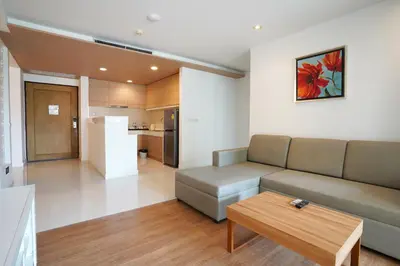 a living room with a couch and a table at Hotel COCO Phuket Bangtao Beach in Bang Tao Beach