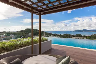 a view of the ocean from a house at Panora Condo by Villacarte in Surin Beach