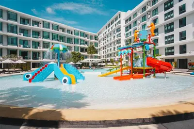 a playground in the water in front of a building at Wyndham La Vita Rawai Phuket in Rawai Beach