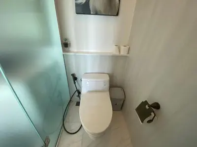 a small bathroom with a toilet and a shower at Phuket View Coffee and Resort in Chalong