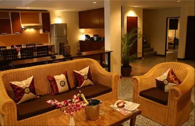 a living room with a couch and a table at Tolmaj Family Apartment in Ao Nang Beach