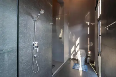 a bathroom with a shower stall and a toilet at La Belle Pool Villa Phuket - Home Away from HOME in Bang Tao Beach