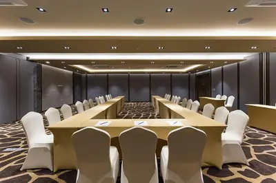 a conference room with a long table and chairs at Pamookkoo in Kata Beach