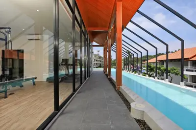 an image of a swimming pool in a building at The Sea View room in Palmyrah Surin by Holy Cow in Surin Beach