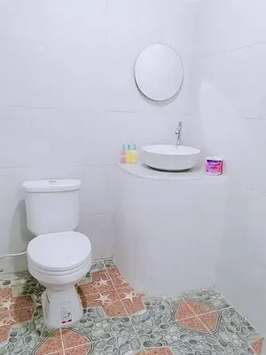 a bathroom with a white toilet and a sink at Baan seefa homestay kohyaoyai in Ko Yao Yai
