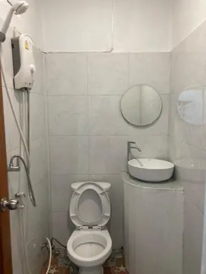 a small bathroom with a toilet and a sink at Baan seefa homestay kohyaoyai in Ko Yao Yai