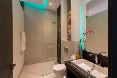 a bathroom with a shower and a toilet and a sink at Villa Omari 5Bedroom with Pool near Kata Beach in Kata Beach