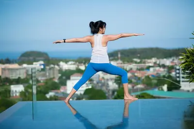 a woman doing yoga on top of a building at Villa Omari 5Bedroom with Pool near Kata Beach in Kata Beach