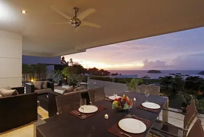a dining room with a view of the ocean at The heights B18 Seaview near Kata Beach in Kata Beach