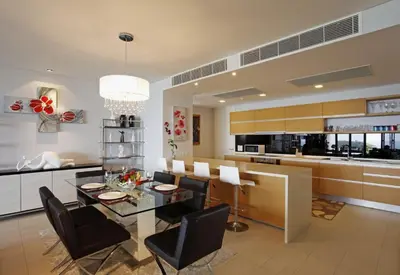 a kitchen and dining room with a glass table and chairs at The heights B18 Seaview near Kata Beach in Kata Beach