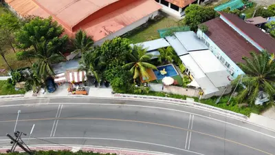 an overhead view of a curvy road in front of a house at At Thara Aonang in Ao Nang Beach