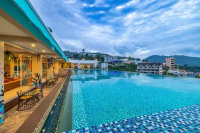 a view of a swimming pool at a hotel at Kana Triple L Hotel Phuket\u666e\u5409\u5c9b\u5361\u5a1c3L\u9152\u5e97 in Patong Beach