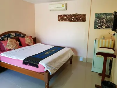 a bedroom with a bed in a room at Discovery House Hotel SHA Plus in Nai Yang Beach