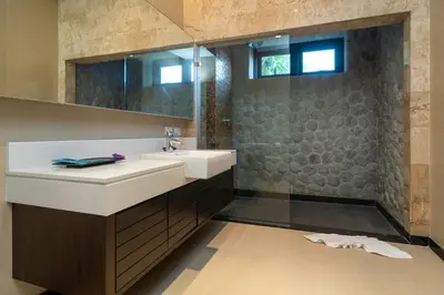 a bathroom with a sink and a mirror at The Harmony Pool Villa Phuket in Bang Tao Beach