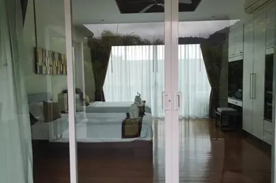 a bedroom with a bed in a room at 4 Bedroom Villa Kamala Beach Phuket in Kamala Beach