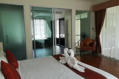 a stuffed animal is sitting on top of a bed at 4 Bedroom Villa Kamala Beach Phuket in Kamala Beach