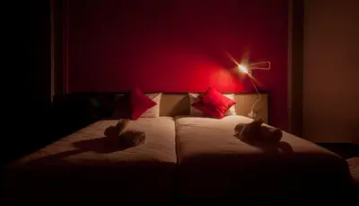 a bedroom with a bed with two teddy bears on it at Chalong Sea Breeze in Chalong