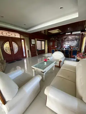 a living room with white furniture and a table at Phuket Pool Villa Sea view at town in Phuket Town