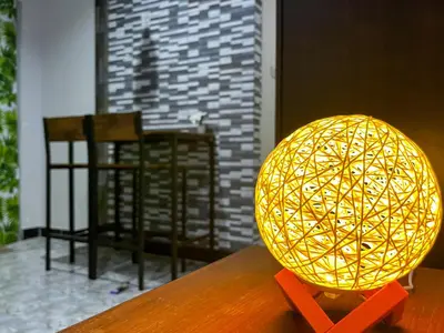 a yellow orb sitting on top of a table at Bangtao Kitchen Studio in Bang Tao Beach