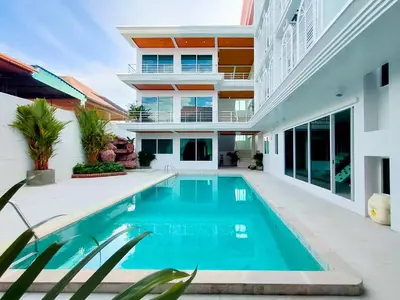 a swimming pool in the backyard of a house at Peranakan House in Phuket Town