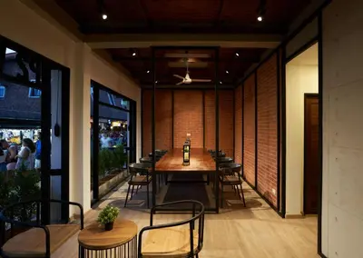 a dining room with a table and chairs at P2 Wood Loft in Phi Phi Don