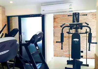 a room with a gym with two exercise bikes at Studio Sea View Patong in Patong Beach