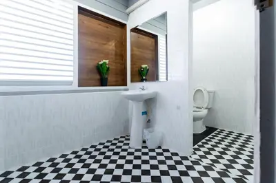 a bathroom with a sink and a toilet at Aladdin Guest House in Phi Phi Don
