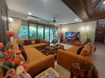 a living room with couches and a flat screen tv at Saifon Villas - Luxurious Pool Villas in Ao Nang Beach