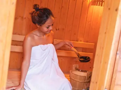 a young woman in a sauna holding a spoon at Katamanda - Villa Amanzi by Elite Havens in Kata Beach