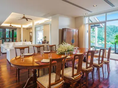 a dining room with a table and chairs at Katamanda - Villa Amanzi by Elite Havens in Kata Beach