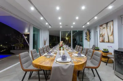 a large dining room with a long table and chairs at Villa Beyond 9 Bedrooms Seaview - Full Services in Bang Tao Beach