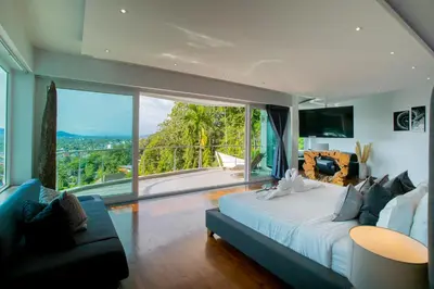 a bedroom with a large bed and a large window at Villa Beyond 9 Bedrooms Seaview - Full Services in Bang Tao Beach