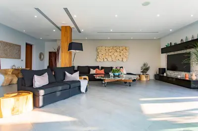 a living room with a couch and a table at Villa Namaste 7 Bedroom Fully Staffed Seaview Villa in Bang Tao Beach