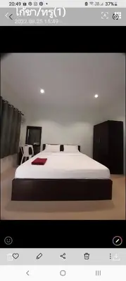a picture of a bedroom with a large bed at Teahouse in Phuket Town