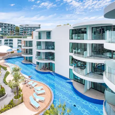 an aerial view of a building with a swimming pool at Lets Phuket Twin Sands Resort & Spa in Patong Beach