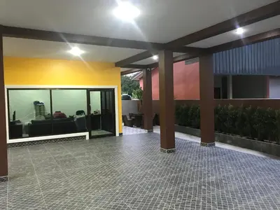 a lobby of a building with a couch in a room at G-HAN Residence in Nai Yang Beach