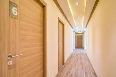 an empty corridor in a hospital with a door at Phuket9 Residence in Chalong