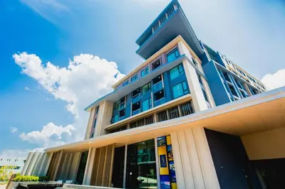 a building with a sign on top of it at Unique loft 2-BR near of Surin Beach, private patio in Surin Beach