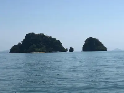 two islands in the water on a boat at Antonio's Ko Yao Noi in Ko Yao Noi
