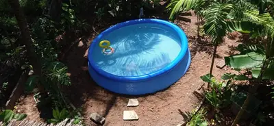 a blue tub sitting on the ground in a yard at Antonio's Ko Yao Noi in Ko Yao Noi
