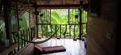 a view of a room with a hammock on a balcony at Antonio's Ko Yao Noi in Ko Yao Noi