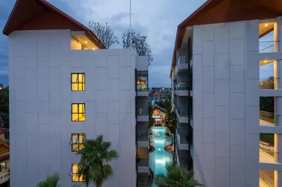 an aerial view of a building with a city at Palmyrah Surin Beach Residence in Surin Beach