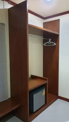 a room with a tv and a wooden closet at ฺBankunyaiy Resort in Ko Yao Yai