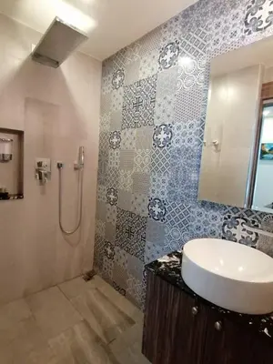 a bathroom with a sink and a shower at Palmyrah Surin Beach By Risa in Surin Beach
