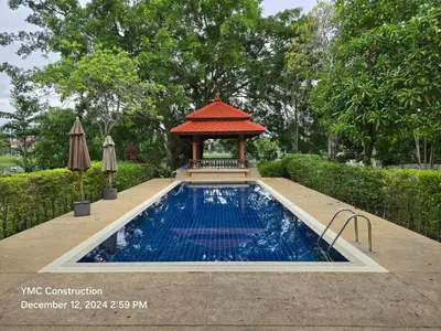 a swimming pool with a gazebo in a garden at laguna waters \u60a6\u6995\u5e84 \u62c9\u53e4\u7eb3 in Bang Tao Beach