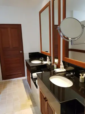 a bathroom with two sinks and a large mirror at laguna waters \u60a6\u6995\u5e84 \u62c9\u53e4\u7eb3 in Bang Tao Beach
