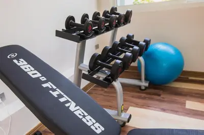 a gym equipment with a fitness ball next to it at Palmetto Condominium in Karon Beach