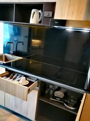 a kitchen with a sink and a stove at Luxury Lagoon 1bedroom Apartment in Kamala Beach