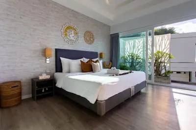 a bedroom with a large bed and a large window at Villa Beyond-Namaste 16 Bedroom Fully Staffed Seaview Villa in Ban Thalat Choeng Thale